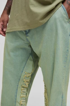 Shop boohooMAN Plus Tinted Applique Inner Gusset Slim Flared Jeans green