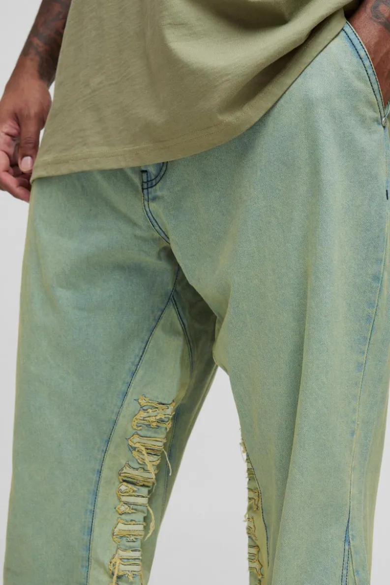 Shop boohooMAN Plus Tinted Applique Inner Gusset Slim Flared Jeans green