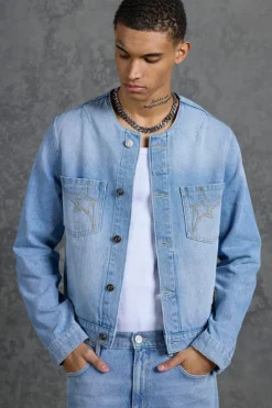 Shop boohooMAN P-Star Regular Fit Boxy Collarless Denim Jacket light blue
