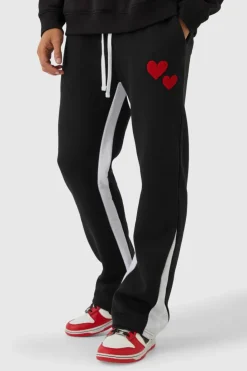 Shop boohooMAN Regular Fit Heart Borg Applique Gusset Jogger black