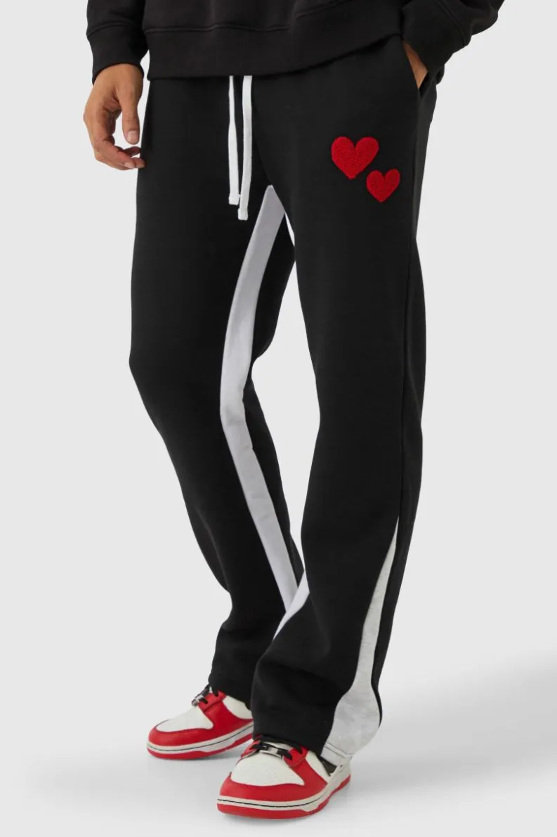 Shop boohooMAN Regular Fit Heart Borg Applique Gusset Jogger black