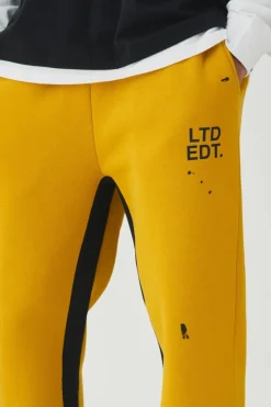 Online boohooMAN Regular Fit Ltd Edt Man Paint Splatter Gusset Jogger yellow