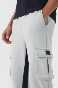 Outlet boohooMAN Regular Fit Raw Hem Woven Tab Gusset Cargo Jogger light grey