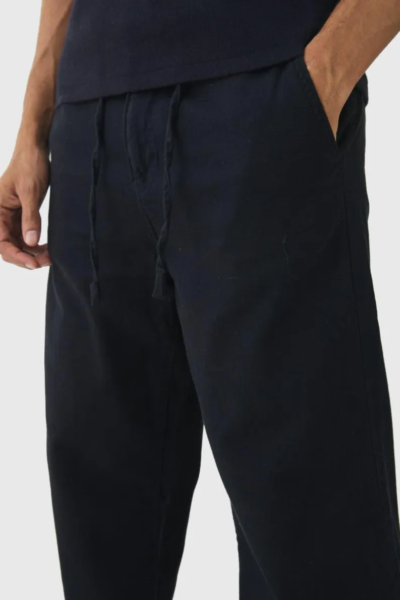 New boohooMAN Relaxed Chinos With Drawcords In black