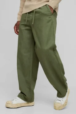 Store boohooMAN Relaxed Chinos With Drawcords In khaki