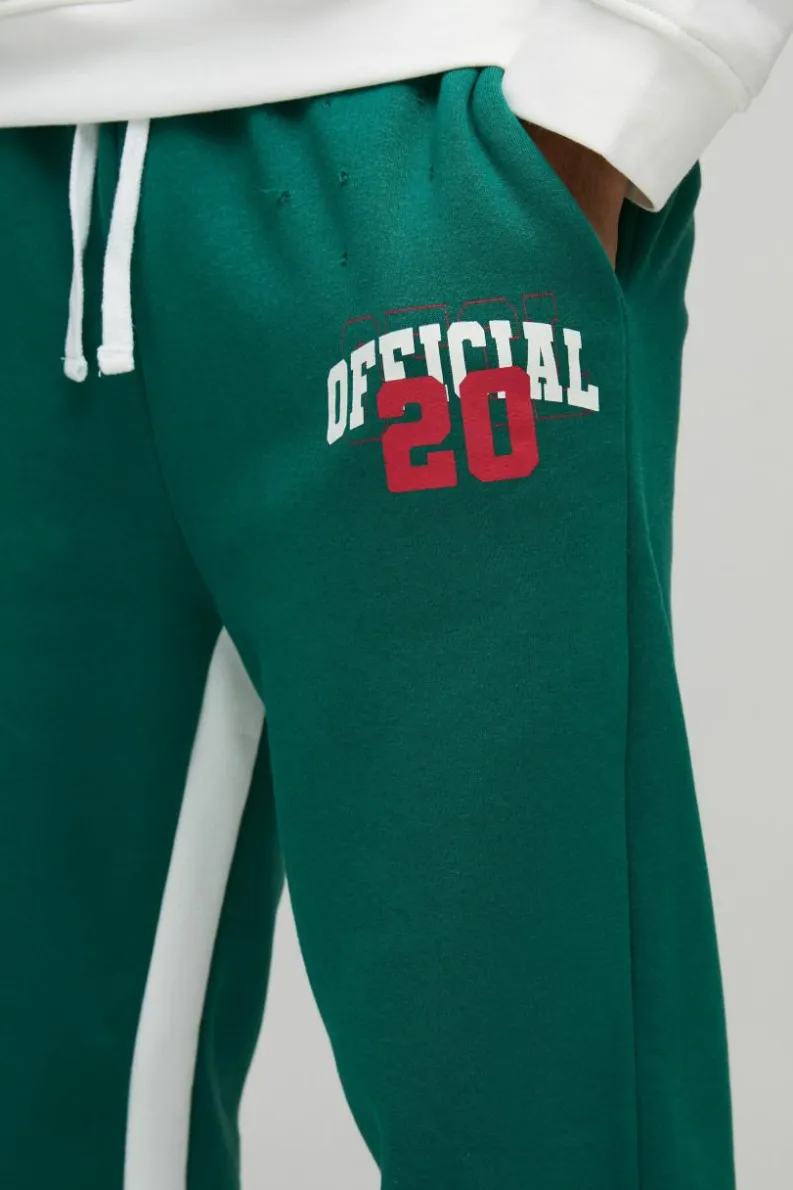 Outlet boohooMAN Relaxed Flare Official Varsity Distressed Gusset Jogger forest
