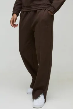 Store boohooMAN Relaxed Heavyweight Embossed Pocket Detail Split Hem Joggers chocolate