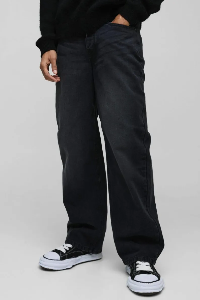 Shop boohooMAN Relaxed Rigid Acid Wash Applique Denim Jeans black