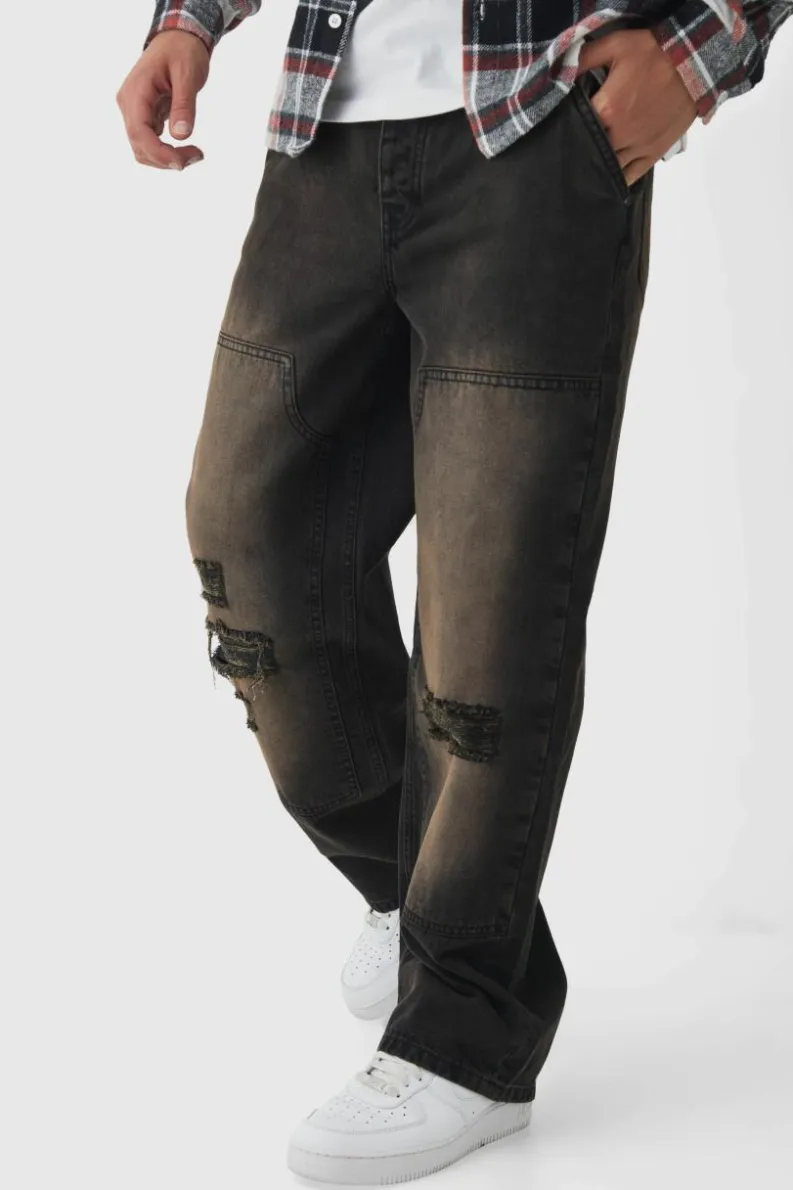 Shop boohooMAN Relaxed Rigid Dirty Wash Ripped Carpenter Denim Jeans dark brown