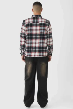 Shop boohooMAN Relaxed Rigid Dirty Wash Ripped Carpenter Denim Jeans dark brown