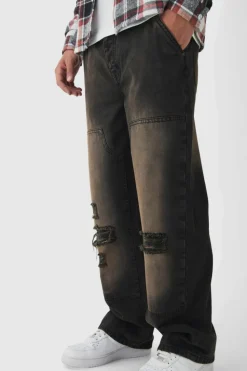 Shop boohooMAN Relaxed Rigid Dirty Wash Ripped Carpenter Denim Jeans dark brown