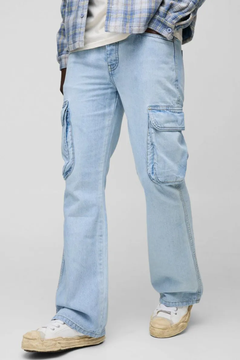 Shop boohooMAN Relaxed Rigid Flare Cargo Denim Jeans light blue