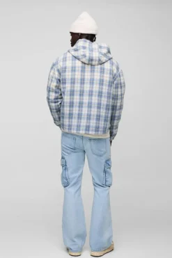 Shop boohooMAN Relaxed Rigid Flare Cargo Denim Jeans light blue