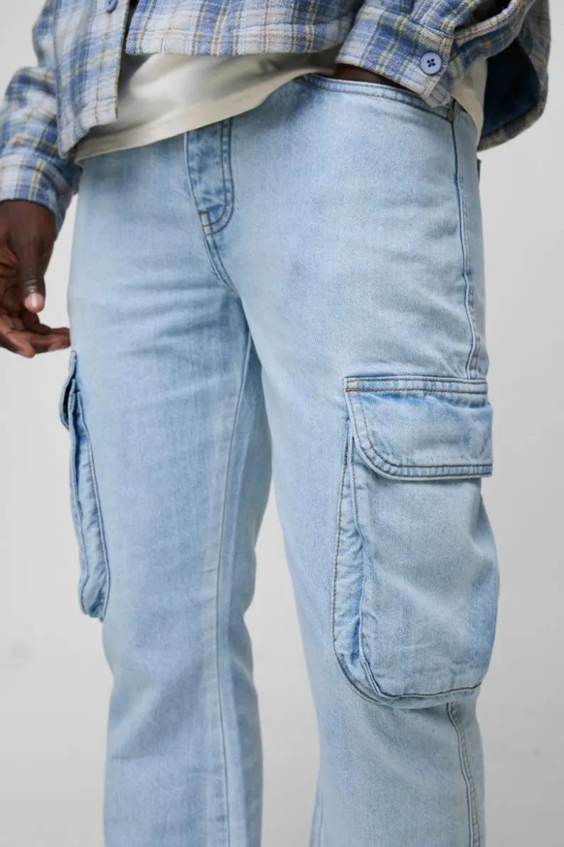 Shop boohooMAN Relaxed Rigid Flare Cargo Denim Jeans light blue