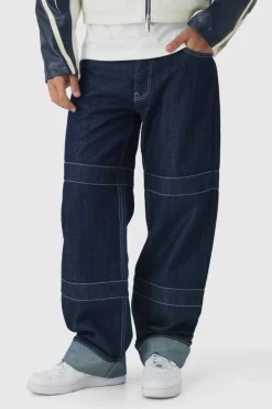 Shop boohooMAN Relaxed Rigid Contrast Embroidered Strap Turn Up Jeans indigo