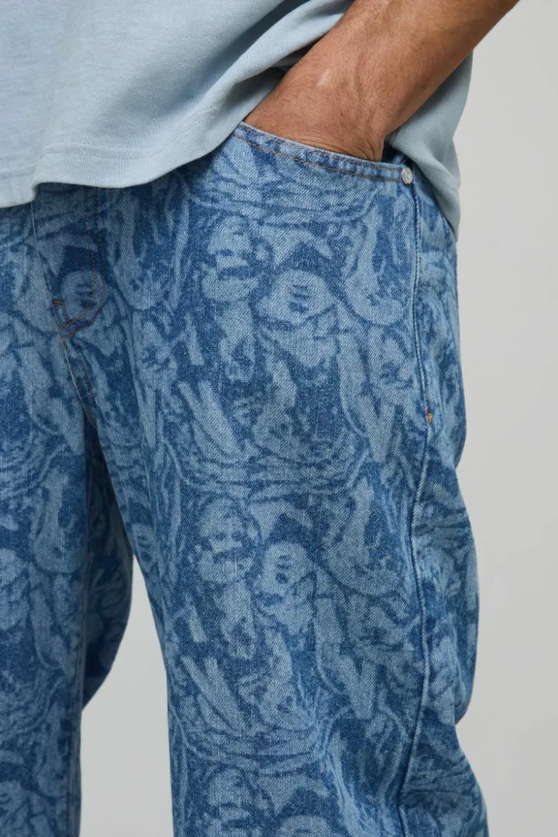 Shop boohooMAN Relaxed Rigid Laser Printed Denim Jeans mid blue