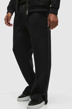 Shop boohooMAN Relaxed Split Hem Scuba Jogger true black