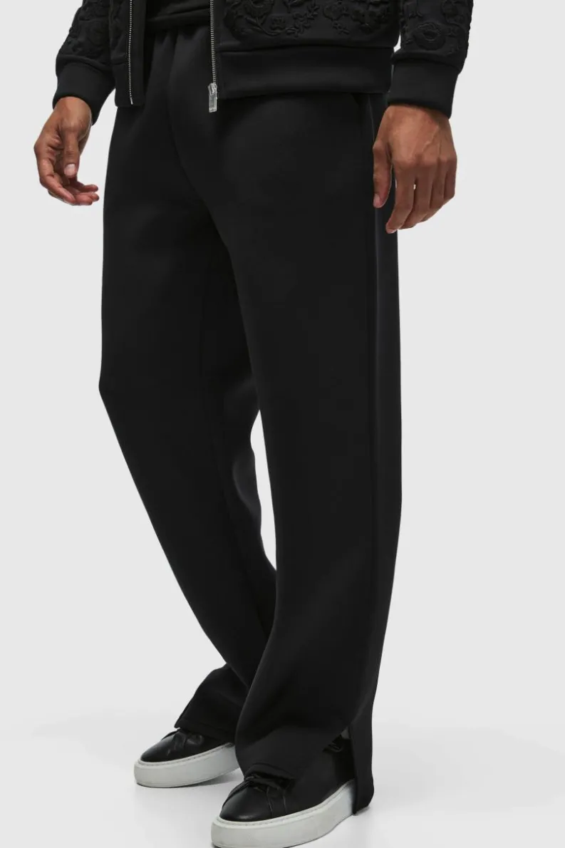 Shop boohooMAN Relaxed Split Hem Scuba Jogger true black