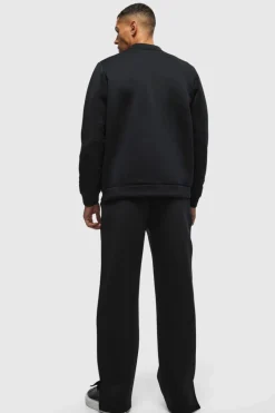 Shop boohooMAN Relaxed Split Hem Scuba Jogger true black