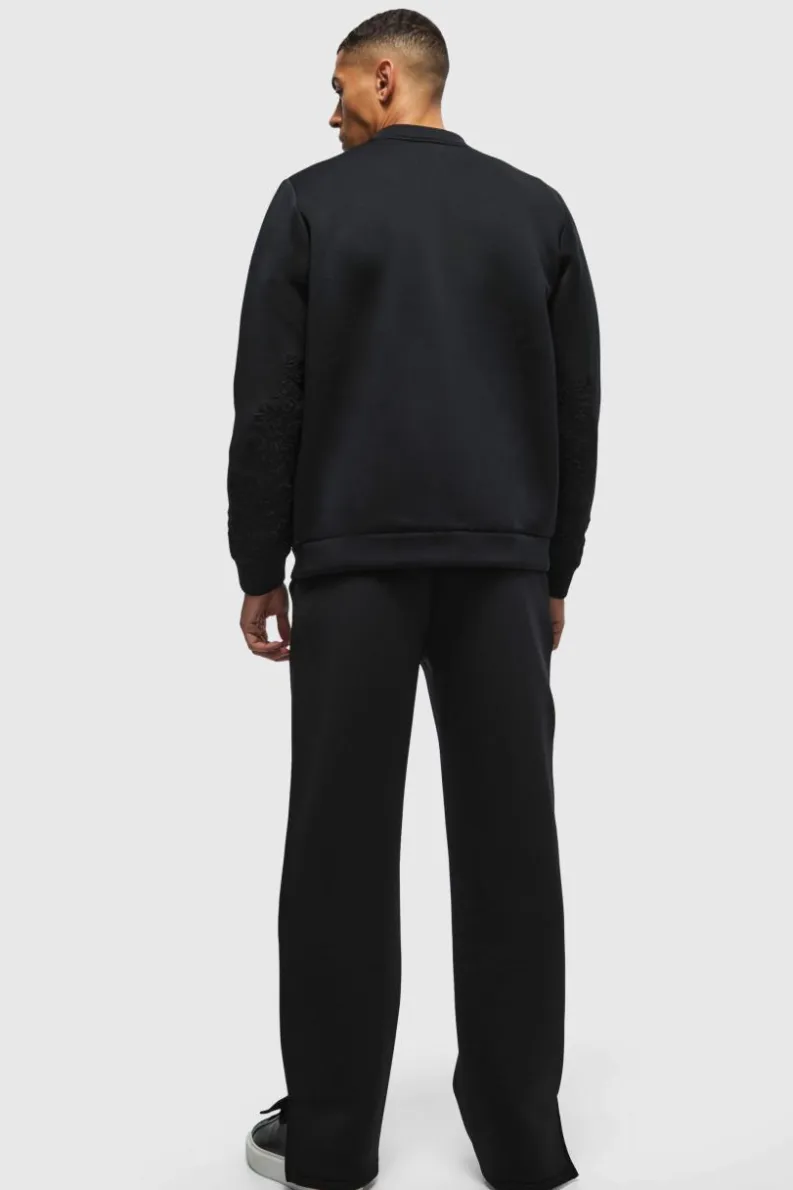 Shop boohooMAN Relaxed Split Hem Scuba Jogger true black