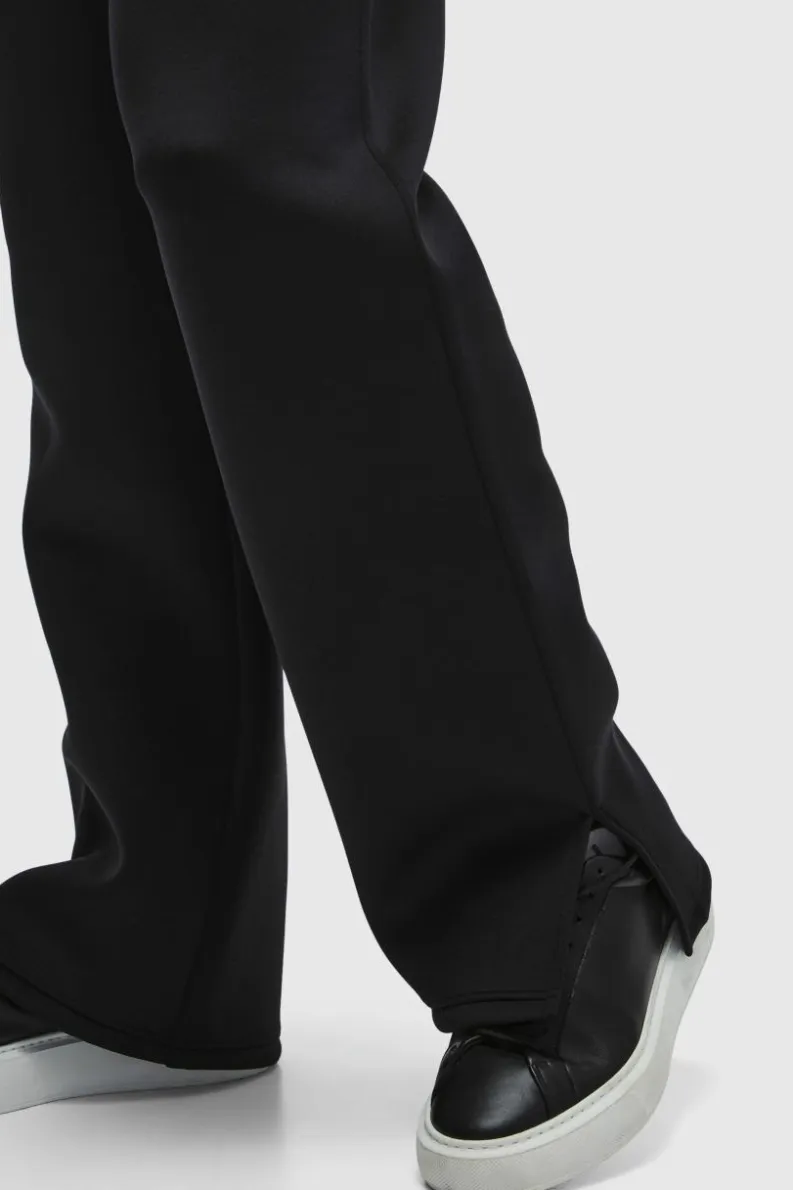 Shop boohooMAN Relaxed Split Hem Scuba Jogger true black