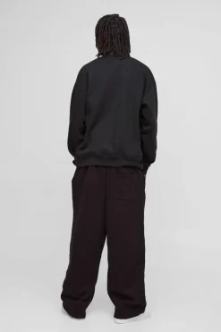 Online boohooMAN Relaxed Wide Leg Double Waistband Distressed Joggers black