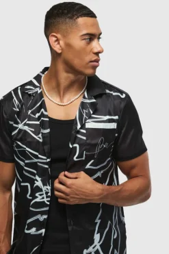 Shop boohooMAN Short Sleeve Satin Tonal Palm Shirt black