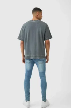Store boohooMAN Skinny Fit All Over Ripped Jeans light blue