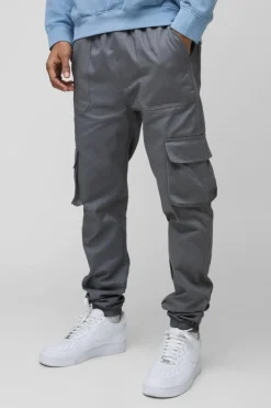 Shop boohooMAN Skinny Fit Elasticated Waist Cuffed Cargo Trousers charcoal
