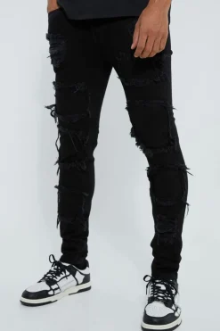 Shop boohooMAN Skinny Stacked Distressed Ripped Jeans true black