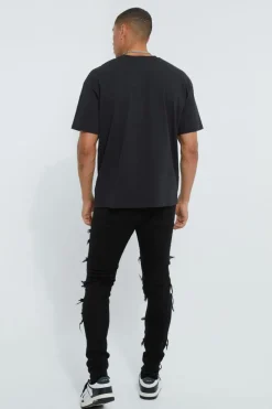 Shop boohooMAN Skinny Stacked Distressed Ripped Jeans true black