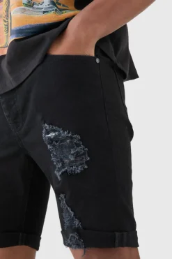 Store boohooMAN Skinny Stretch Distressed Denim Shorts In Black true black