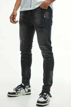 Online boohooMAN Skinny Stretch Knee Rip Paint Splatter Jeans washed black