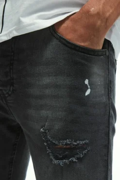 Online boohooMAN Skinny Stretch Knee Rip Paint Splatter Jeans washed black