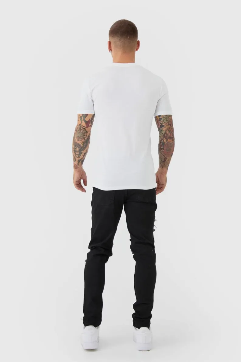 Shop boohooMAN Skinny Stretch Ripped Chain Jeans black