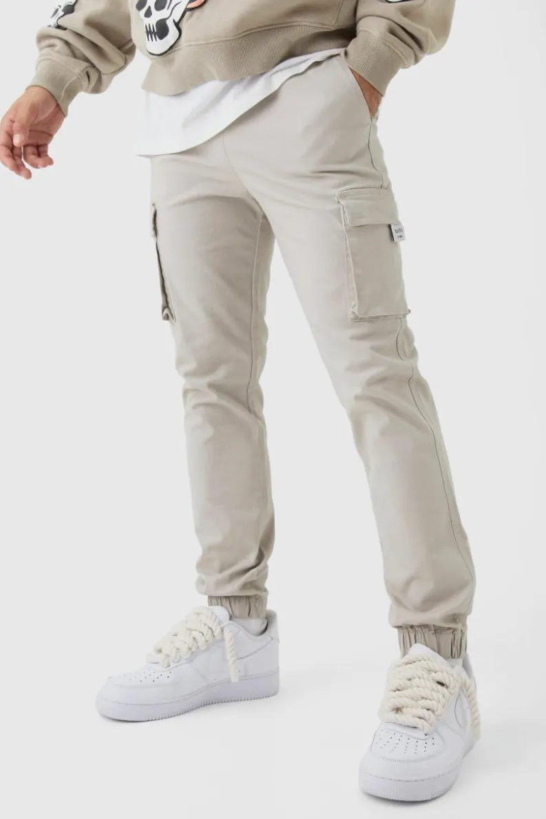 Store boohooMAN Slim Fit Elasticated Waist Woven Tab Cuffed Cargo Trousers stone