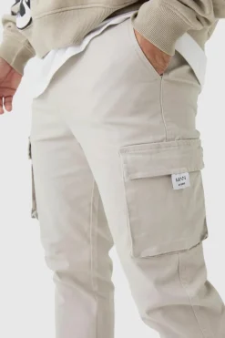 Store boohooMAN Slim Fit Elasticated Waist Woven Tab Cuffed Cargo Trousers stone