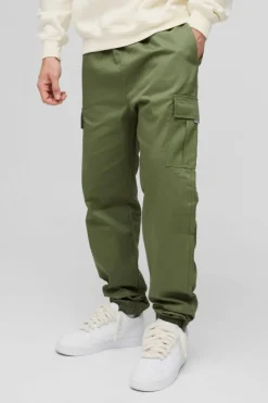 Shop boohooMAN Slim Fit Elasticated Waist Woven Tab Cuffed Cargo Trousers khaki