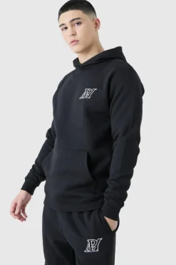 Shop boohooMAN Slim Fit Embroidered Cargo Tracksuit black