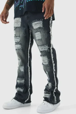 New boohooMAN Slim Flared All Over Ripped Jeans With Let Down Hem grey