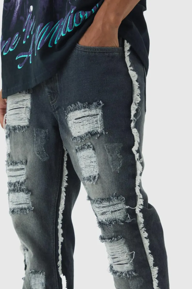 New boohooMAN Slim Flared All Over Ripped Jeans With Let Down Hem grey