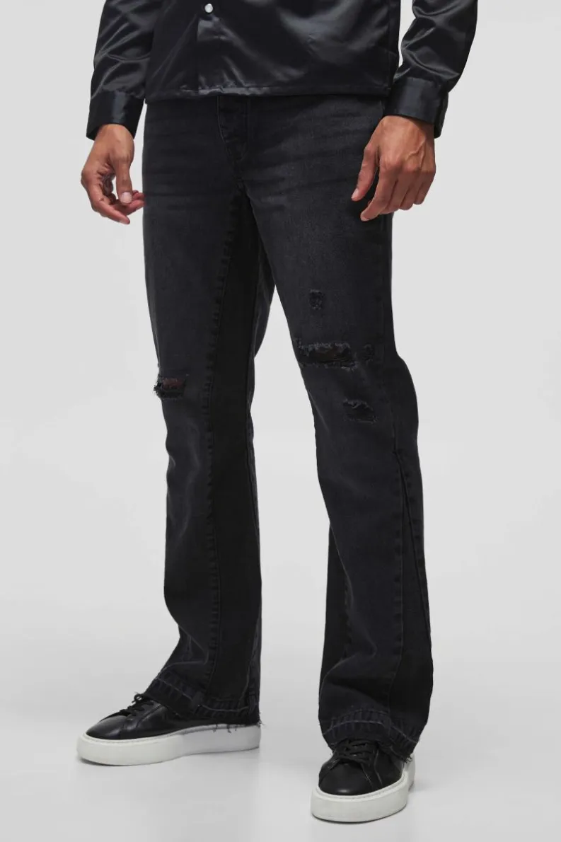 Store boohooMAN Slim Rigid Flare Distressed Gusset Panel Acid Washed Denim Jeans washed black
