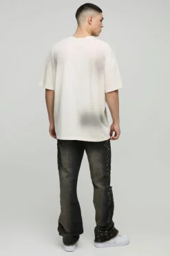 Shop boohooMAN Slim Rigid Flared Stacked Distressed Washed Jeans brown