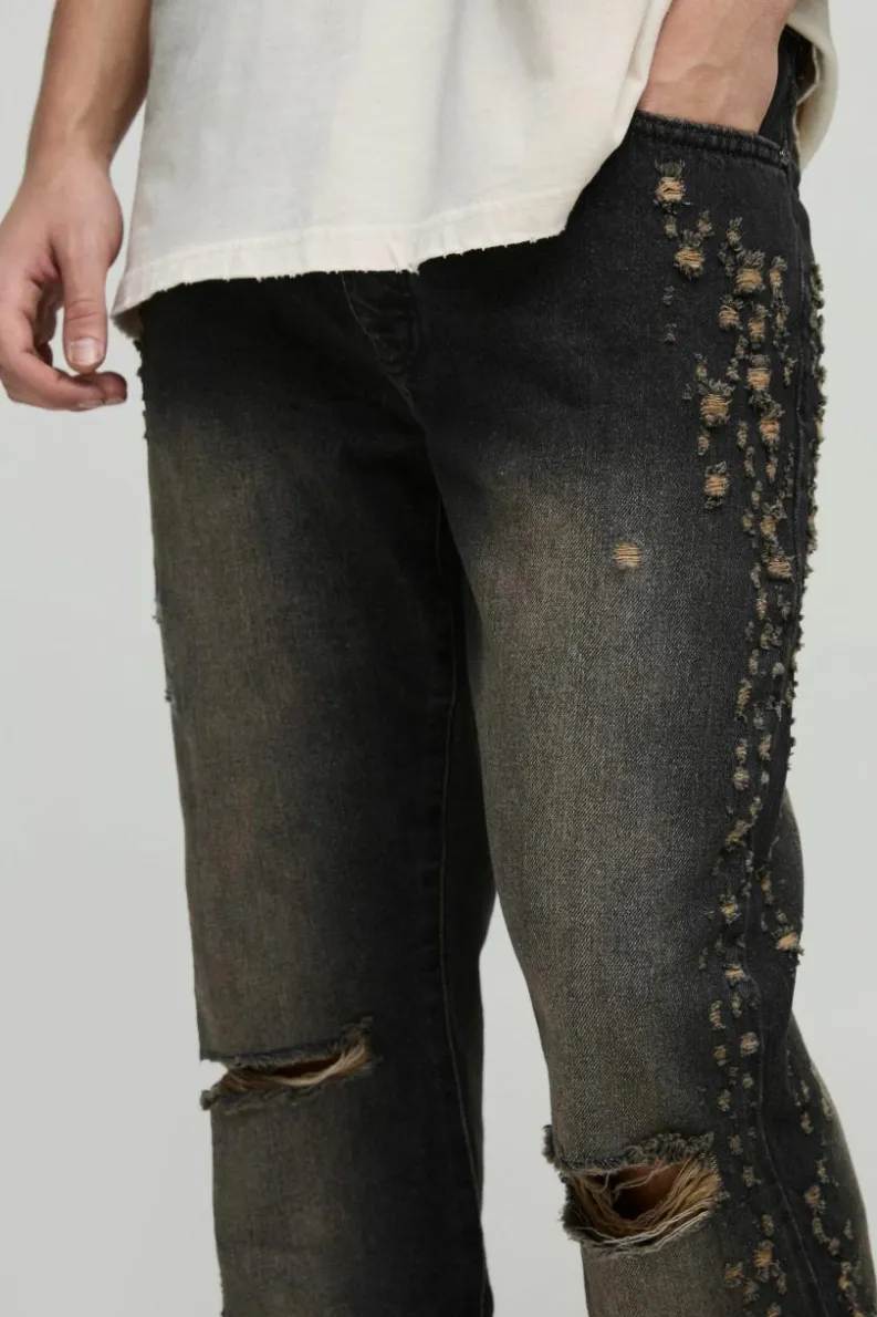 Shop boohooMAN Slim Rigid Flared Stacked Distressed Washed Jeans brown
