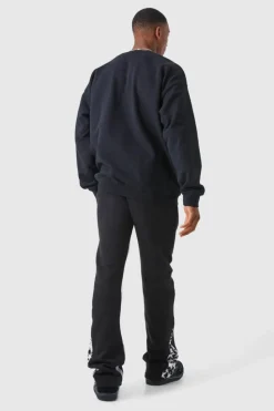 Shop boohooMAN Slim Stacked Flare Star Print Gusset Jogger black