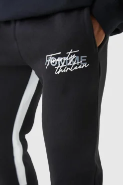 Shop boohooMAN Slim Stacked Flare Star Print Gusset Jogger black