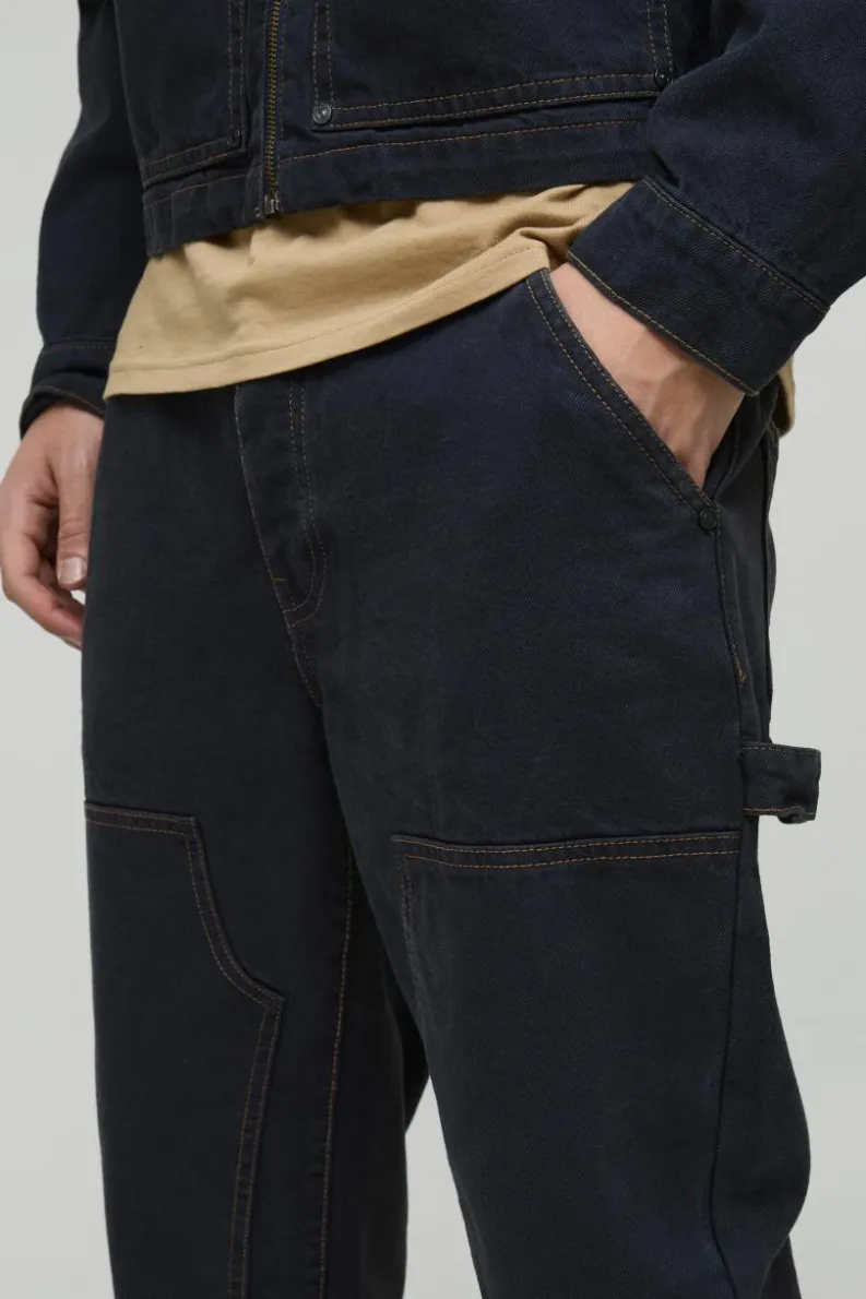 Shop boohooMAN Straight Leg Carpenter Contrast Stitch Jeans dark navy