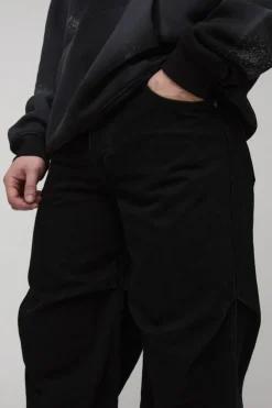 Shop boohooMAN Tall Baggy Ruched Detail Jeans washed black