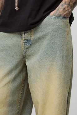 Store boohooMAN Tall Balloon Fit Pleat Knee Tinted Jeans antique wash