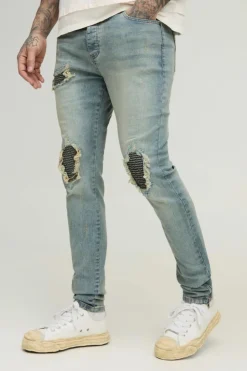 Store boohooMAN Tall Biker Rip & Repair Zip Hem Skinny Jeans stonewash